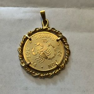 Gold tone Zodiac charm good preowned condition -owned 30 years -